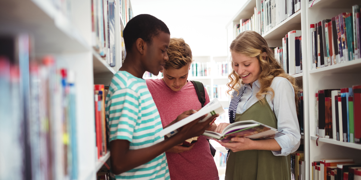 school-kids-reading-books-in-library